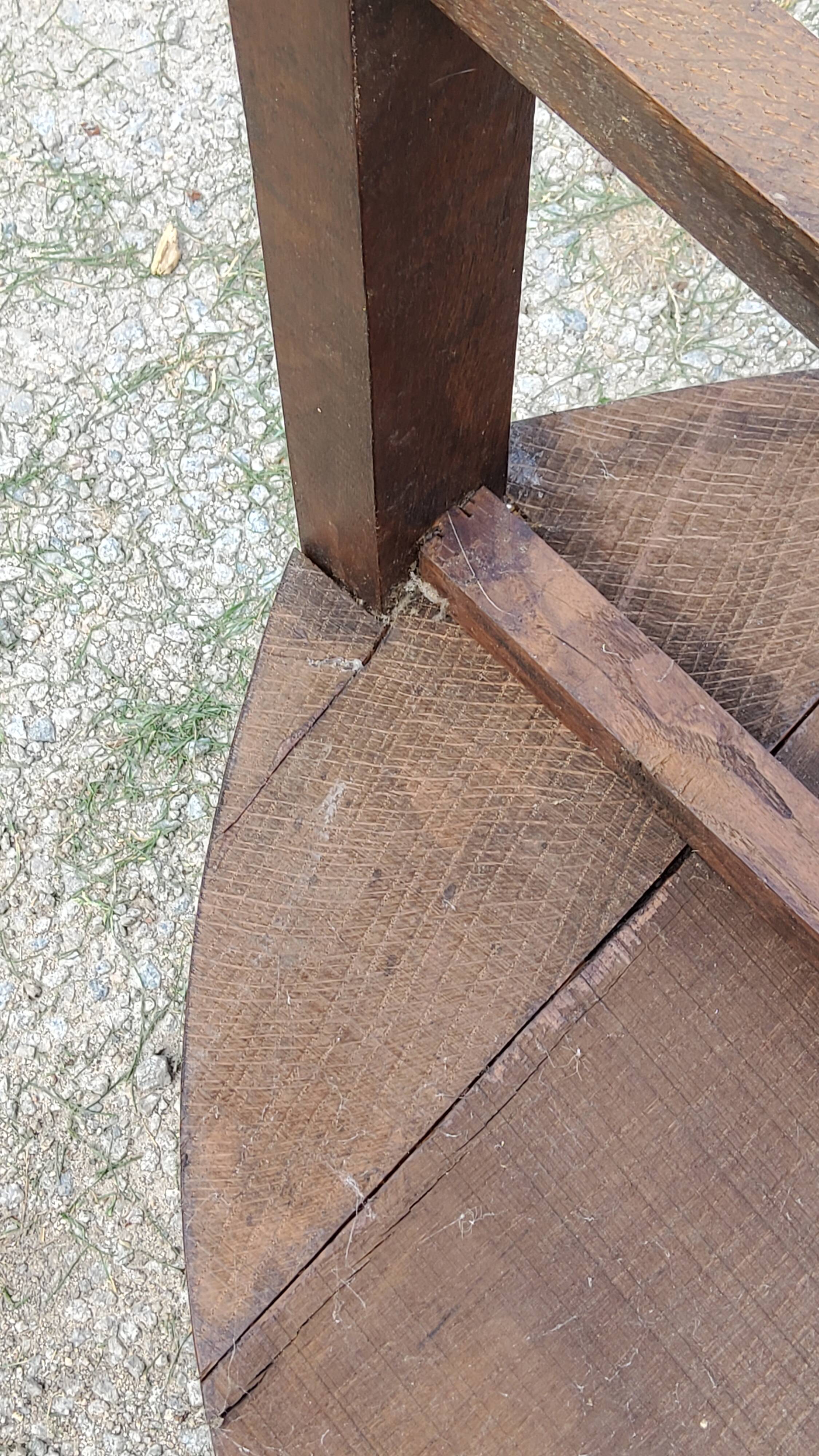Set of three brutalist tripod armchairs in carved solid oak