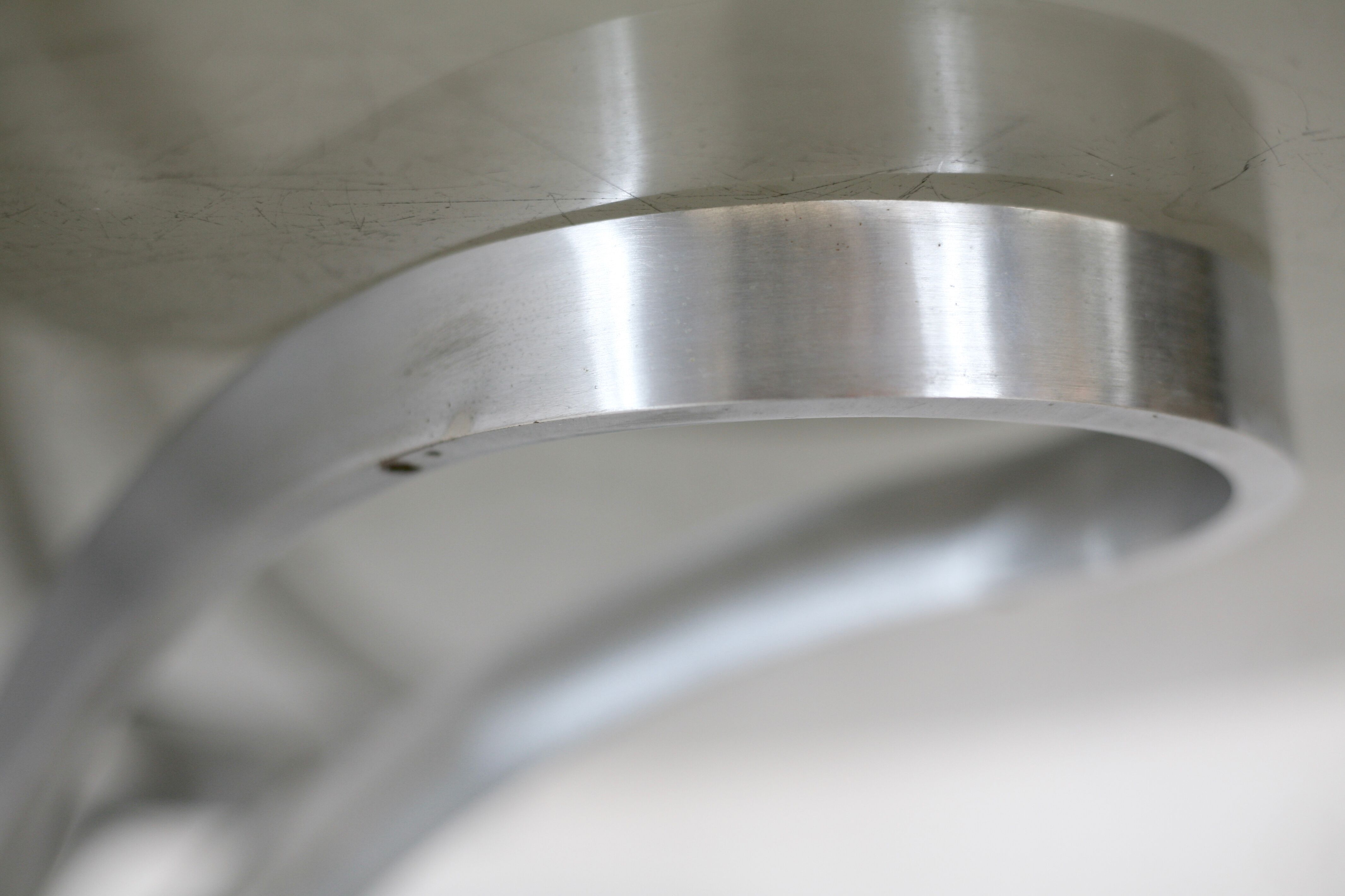 Living room table "Space Age" polished steel, circular slab smoked glass. France, circa 1970.