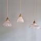Trio of Art Deco scalloped clear glass pendant lights, 1920-30