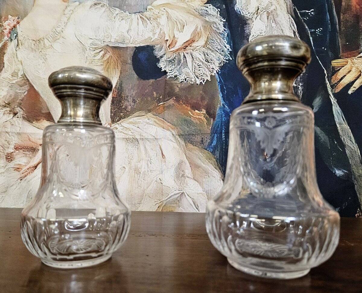 Pair of antique Louis XVI style bottles in finely engraved crystal and silver.
