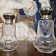 Pair of antique Louis XVI style bottles in finely engraved crystal and silver.