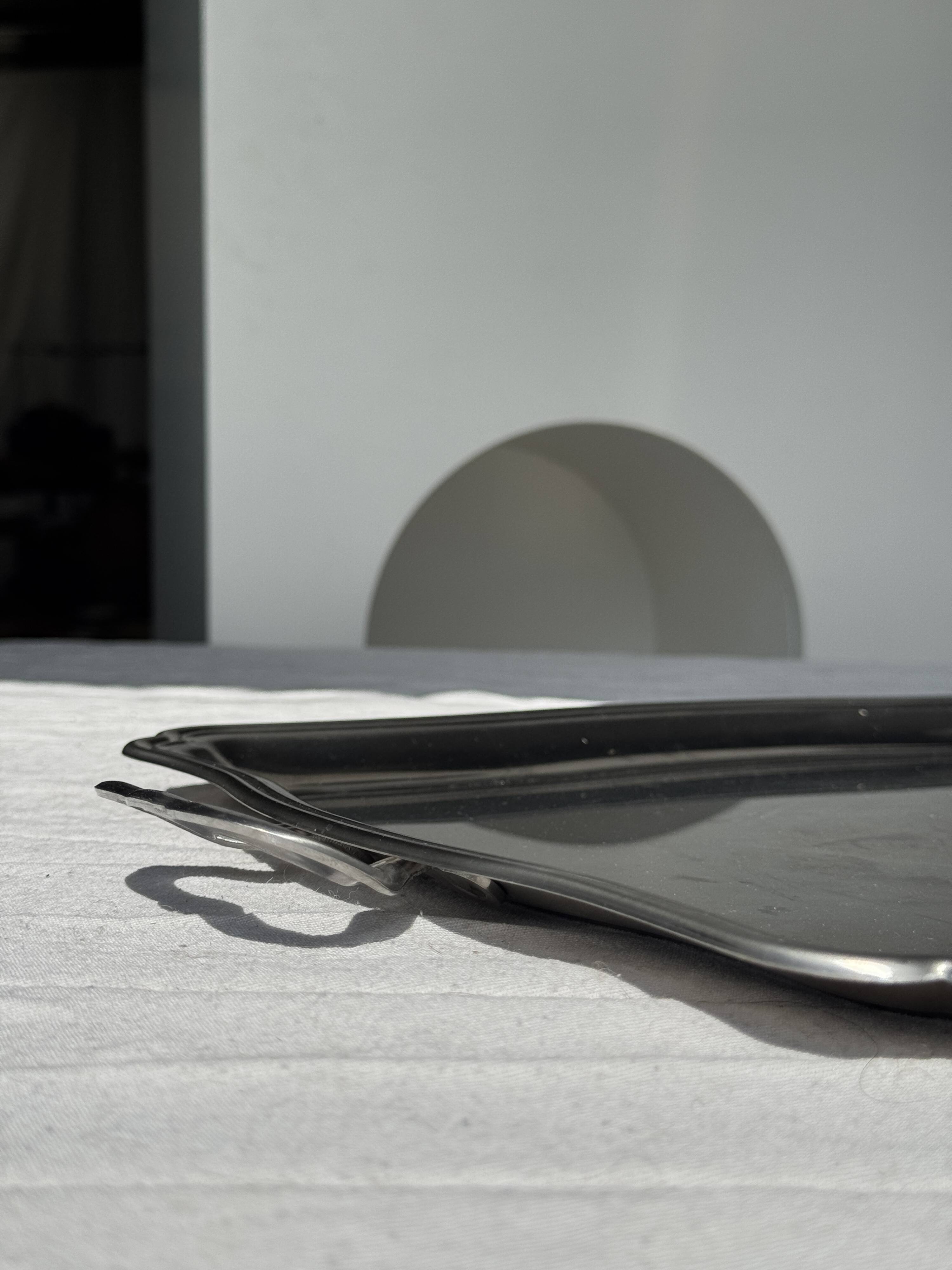 Guy Degrenne silver stainless steel serving tray with an eventful shape