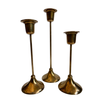 Trio of gold brass candlesticks