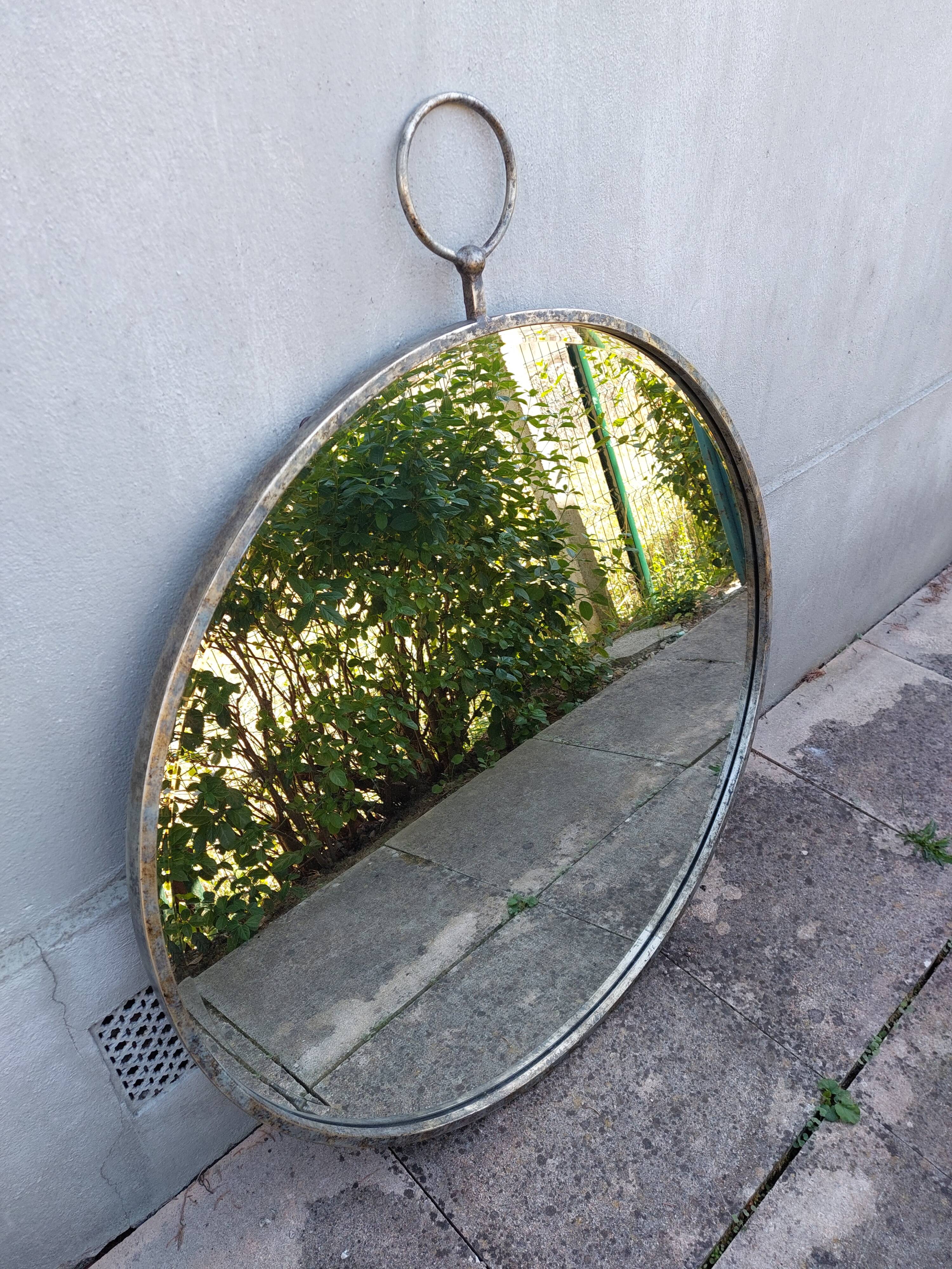 Round patinated mirror