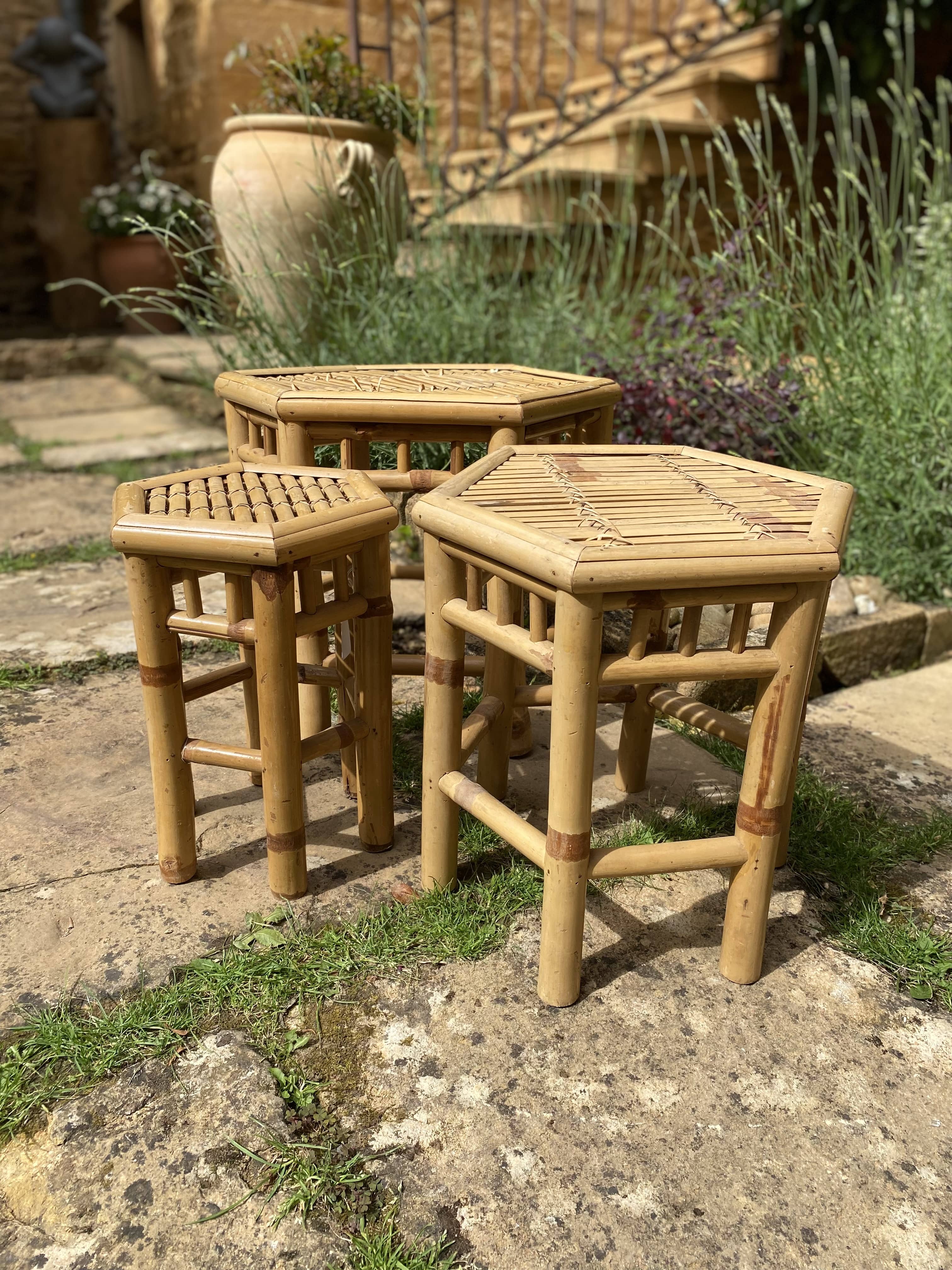 Set of three vintage rattan side tables.