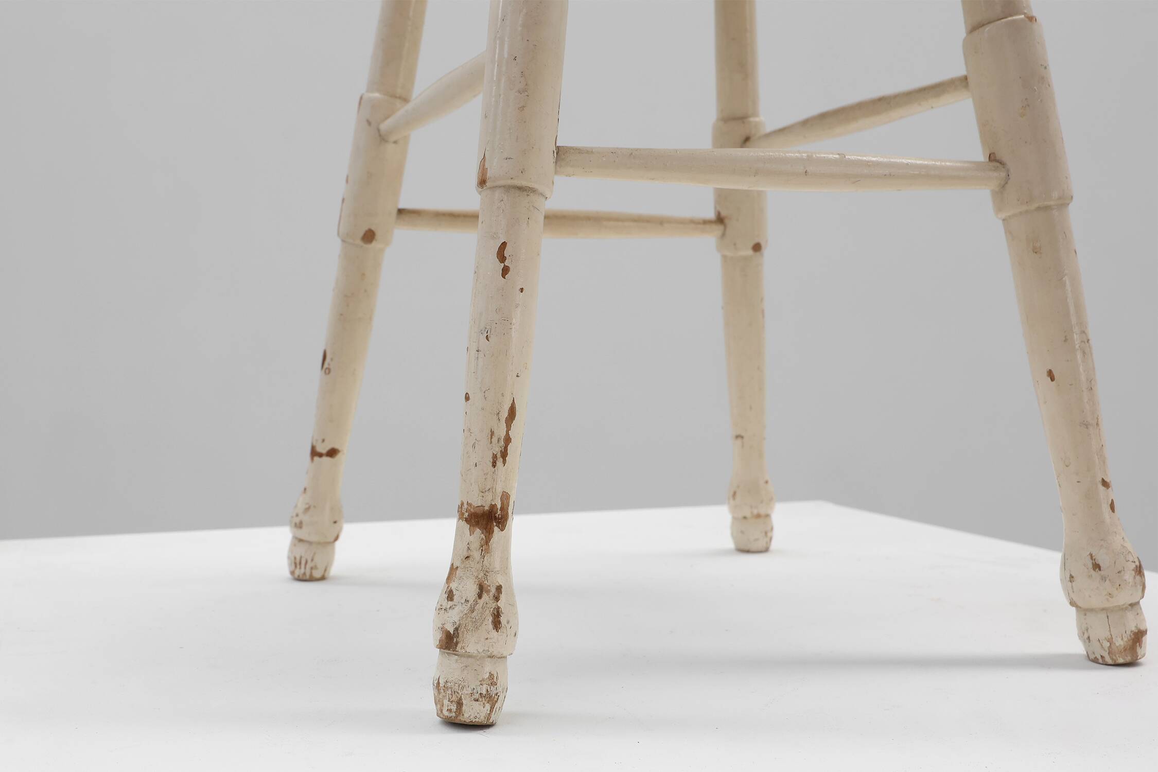 Rustic white wooden low farm stool, France ca. 1920