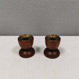 Two beautiful teak candle holders with brass inserts.