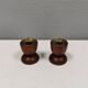 Two beautiful teak candle holders with brass inserts.