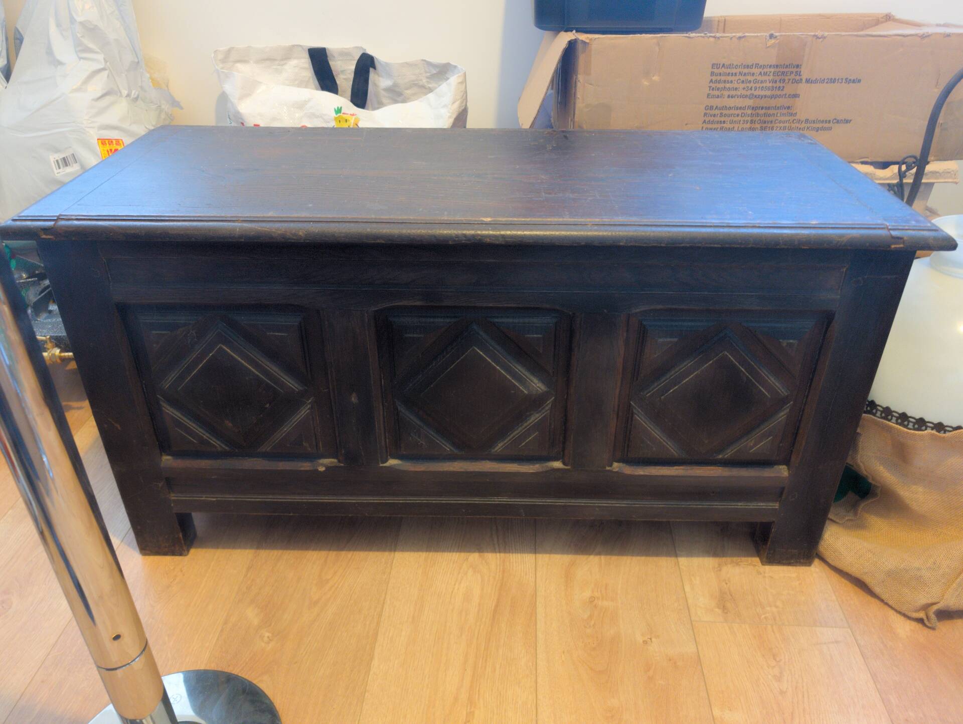 Antique dark wood chest with geometric paneling / pointed detail