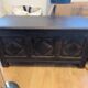 Antique dark wood chest with geometric paneling / pointed detail