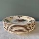 Series of 8 Digoin Sarreguemines flat plates, Agreste collection