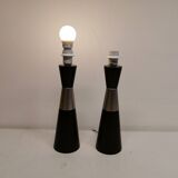 Two table lamps made of dark-stained wood with silver detail in the middle.