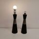 Two table lamps made of dark-stained wood with silver detail in the middle.