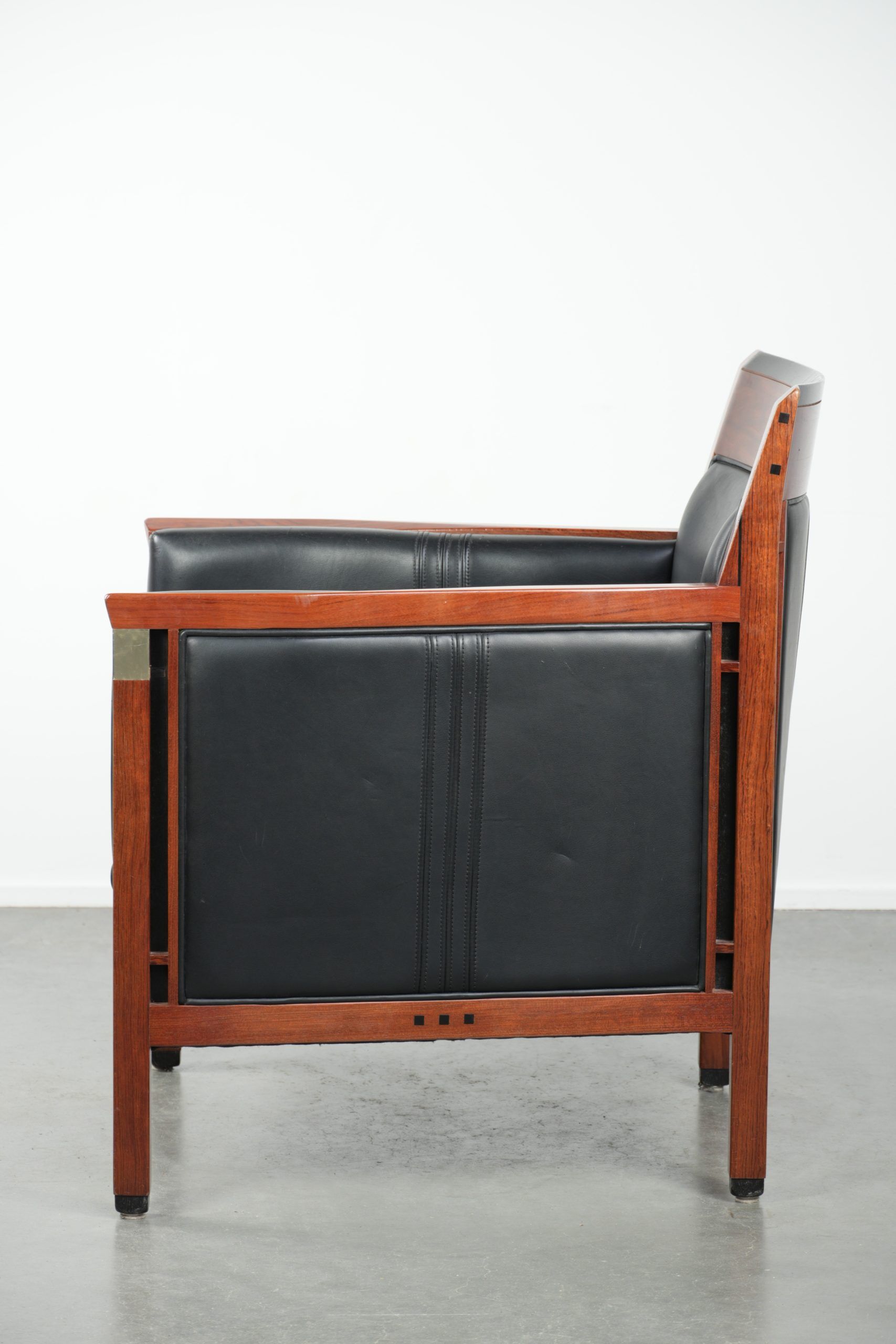 Black leather and wooden Art Deco design armchair