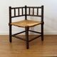 Turned wood corner chair with straw seat