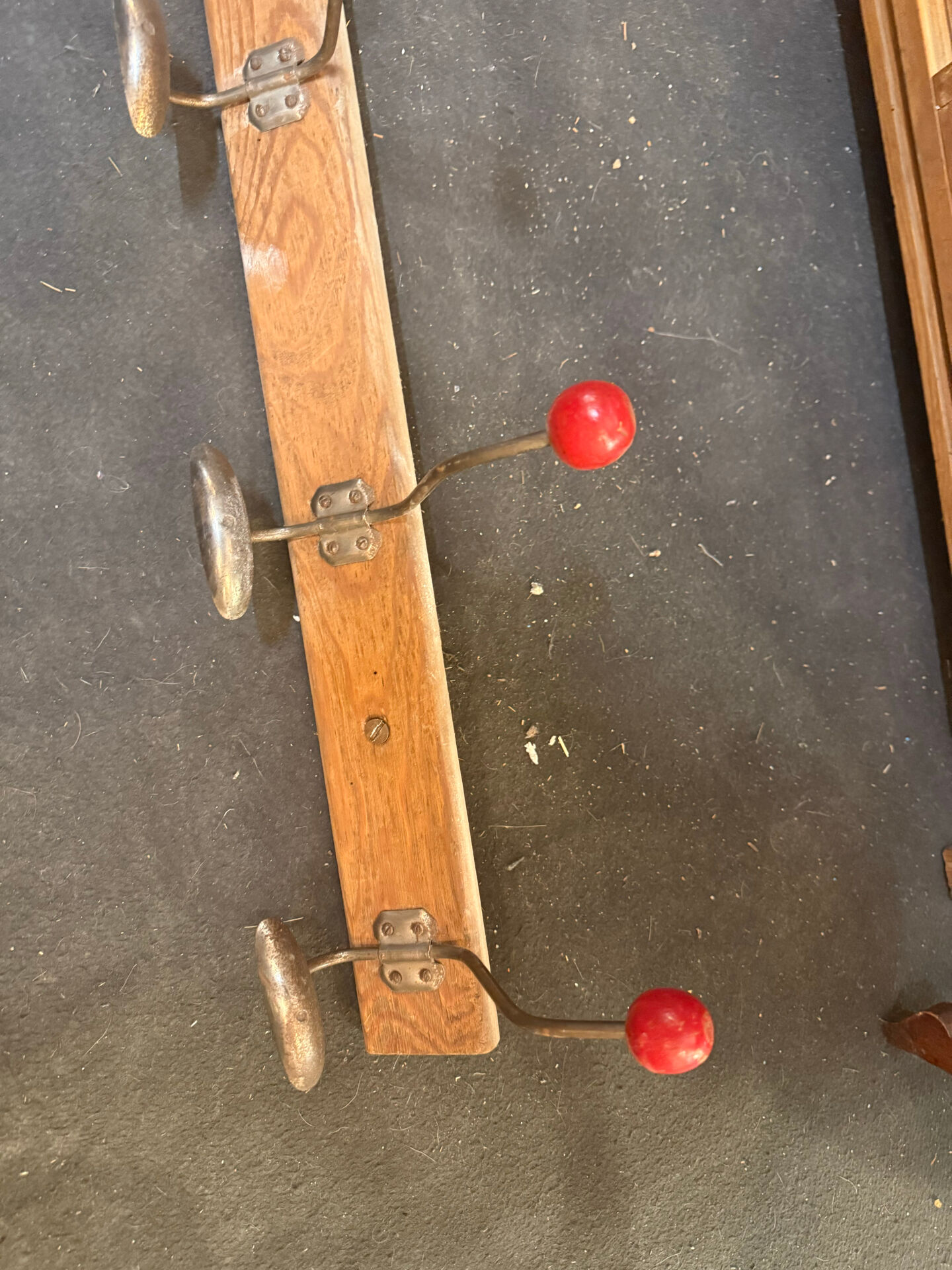 school coat rack / changing room with 10 red ball hooks