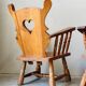Pair of rustic oak armchairs – carved heart backrests