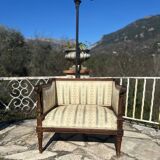 Low armchair in finely carved wood in the Louis XVI style from the 19th century