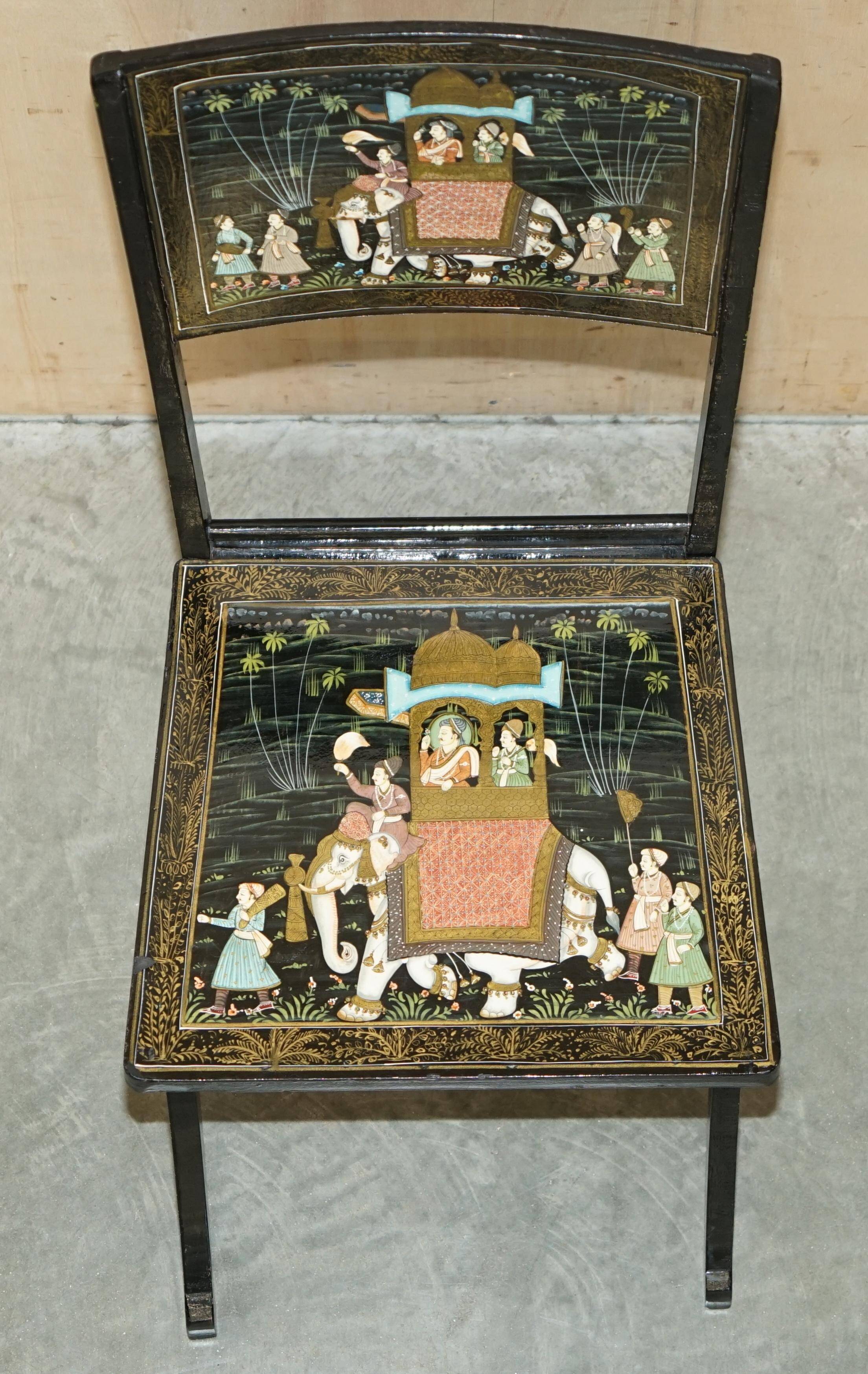 Pair of military folding chairs with Indian decoration.