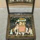 Pair of military folding chairs with Indian decoration.