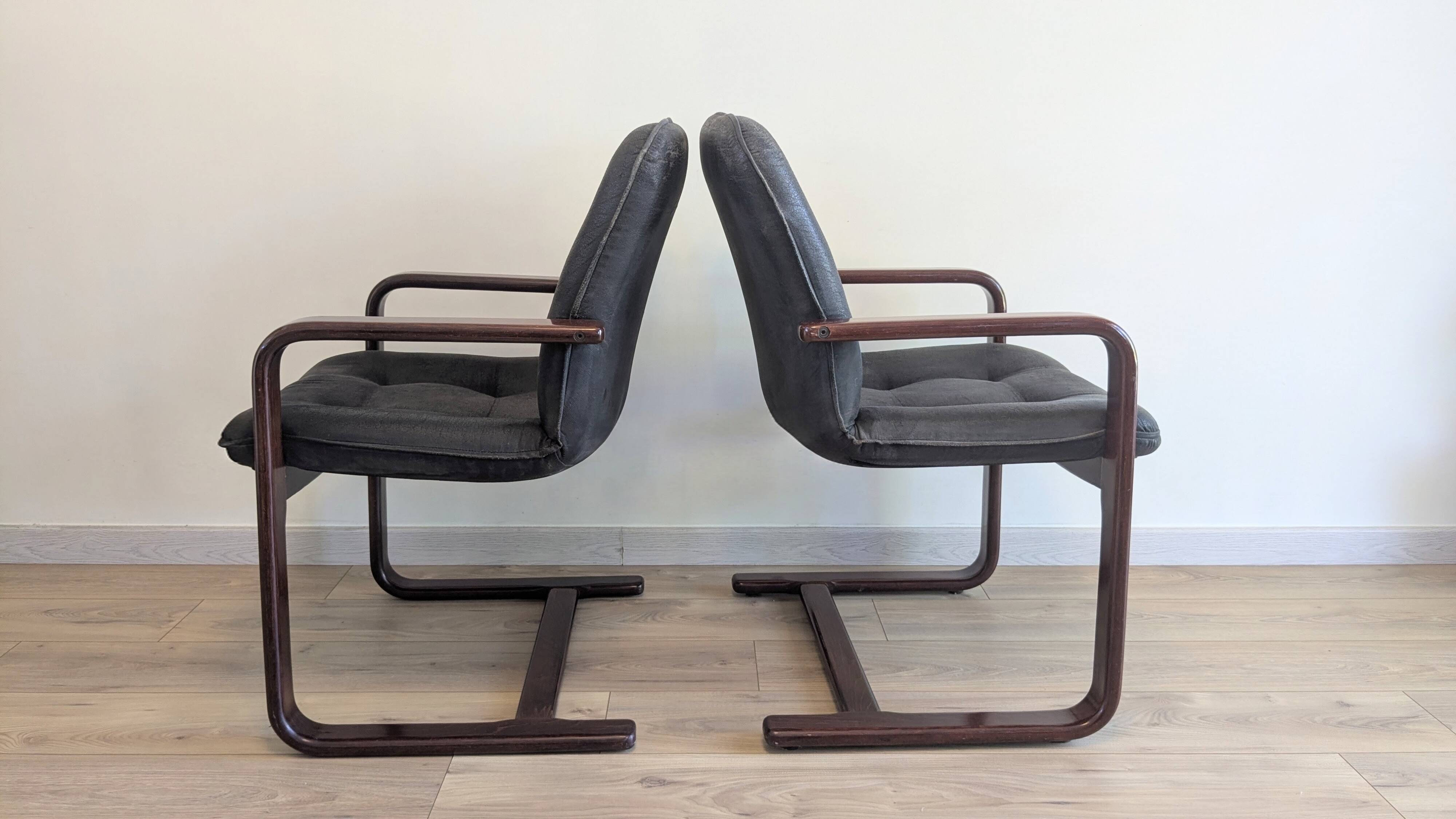 Pair of vintage cantilever armchairs in rosewood veneer.