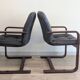 Pair of vintage cantilever armchairs in rosewood veneer.