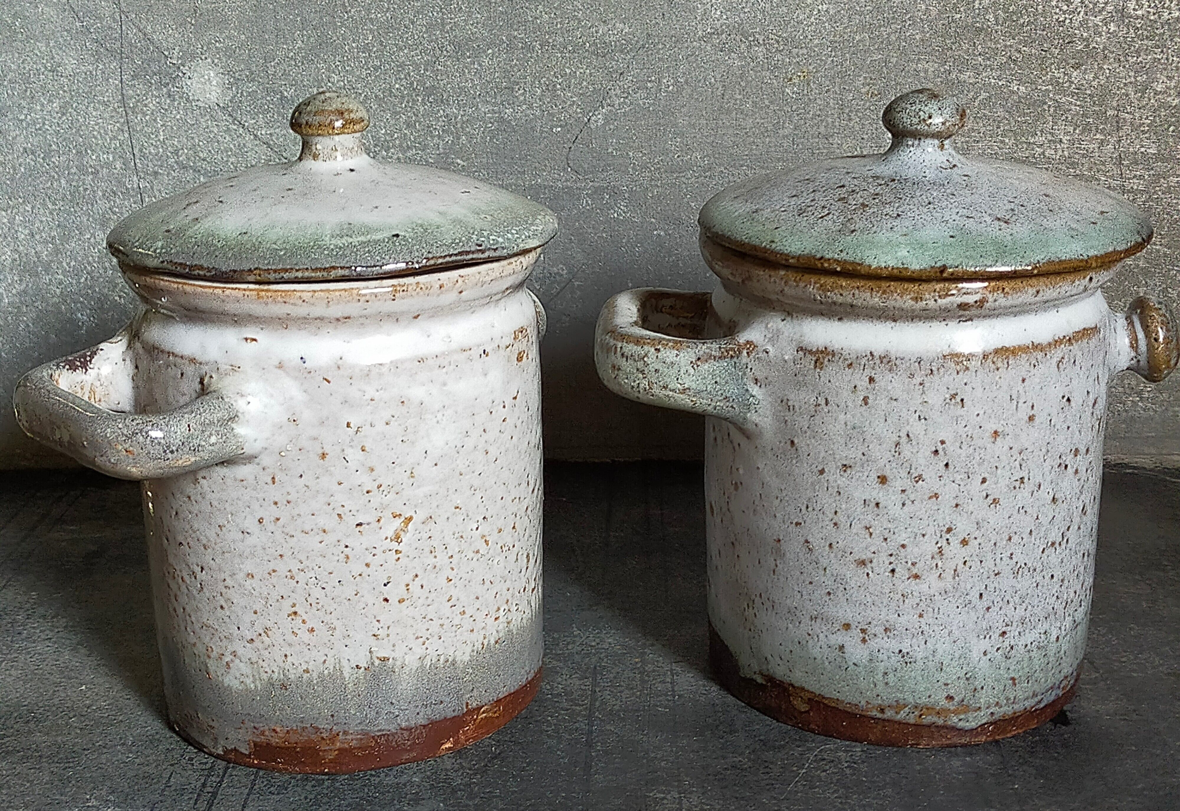 Duo of potter's pots covered in vintage glazed stoneware
