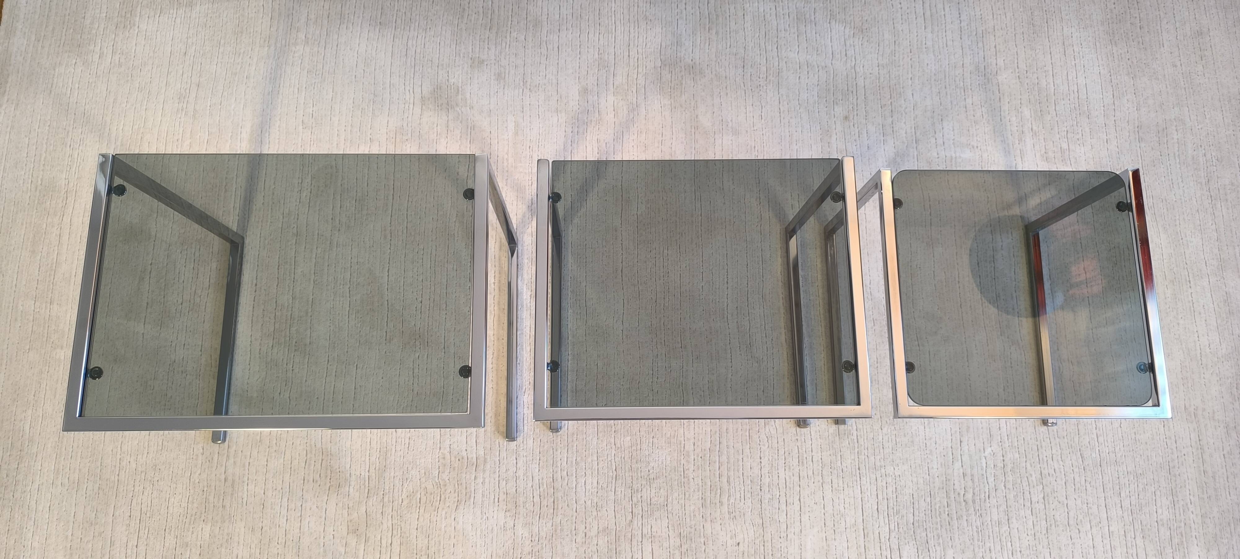 Set of 3 vintage nesting tables in chrome and smoked glass, Roche Bobois style.