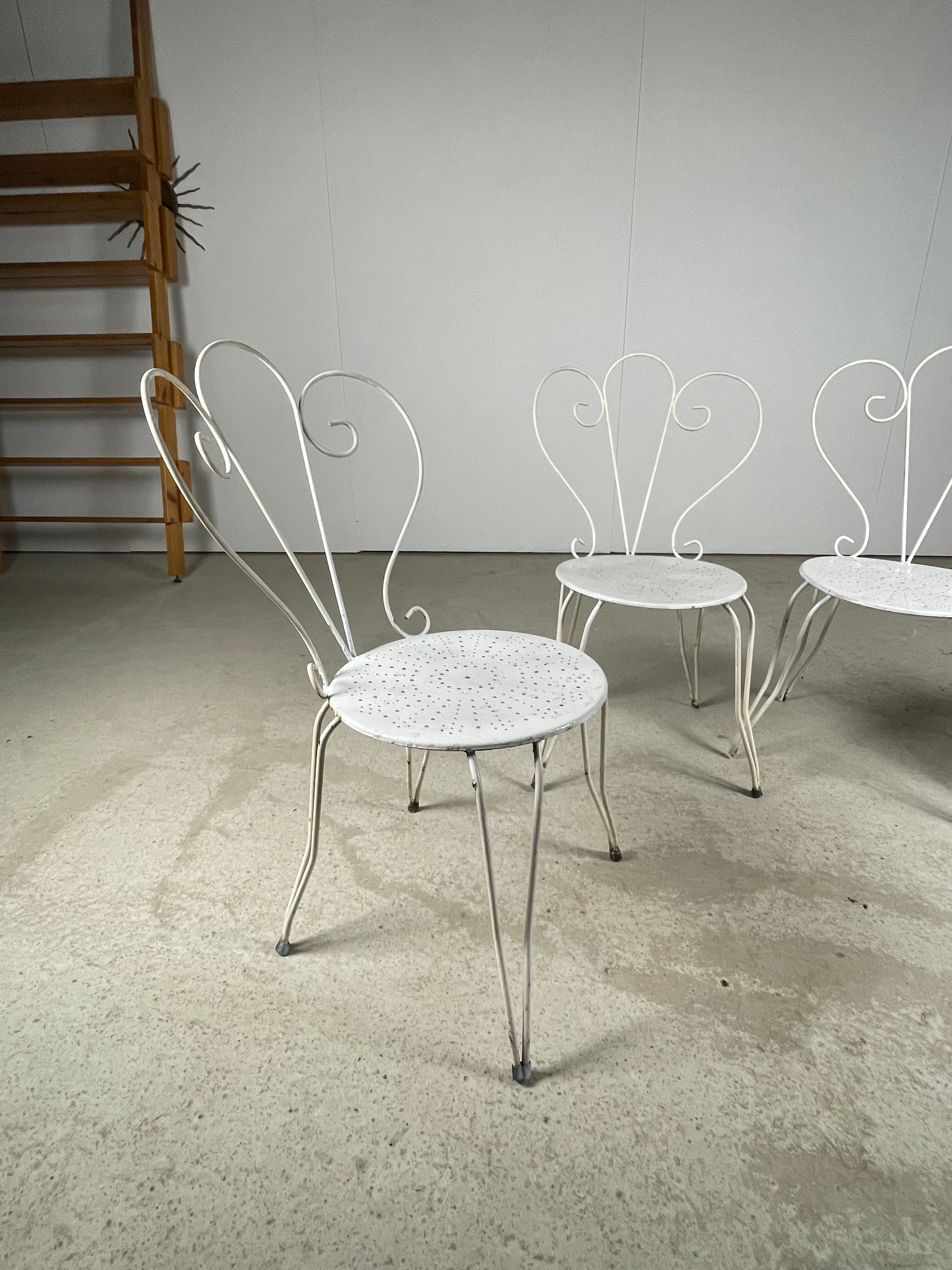 4 vintage wrought iron chairs