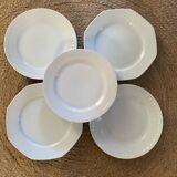 5 mismatched old white plates.
