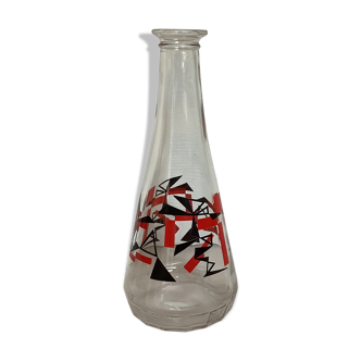Old decanter red and black geometric patterns