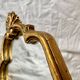 Old small wall mirror in golden resin