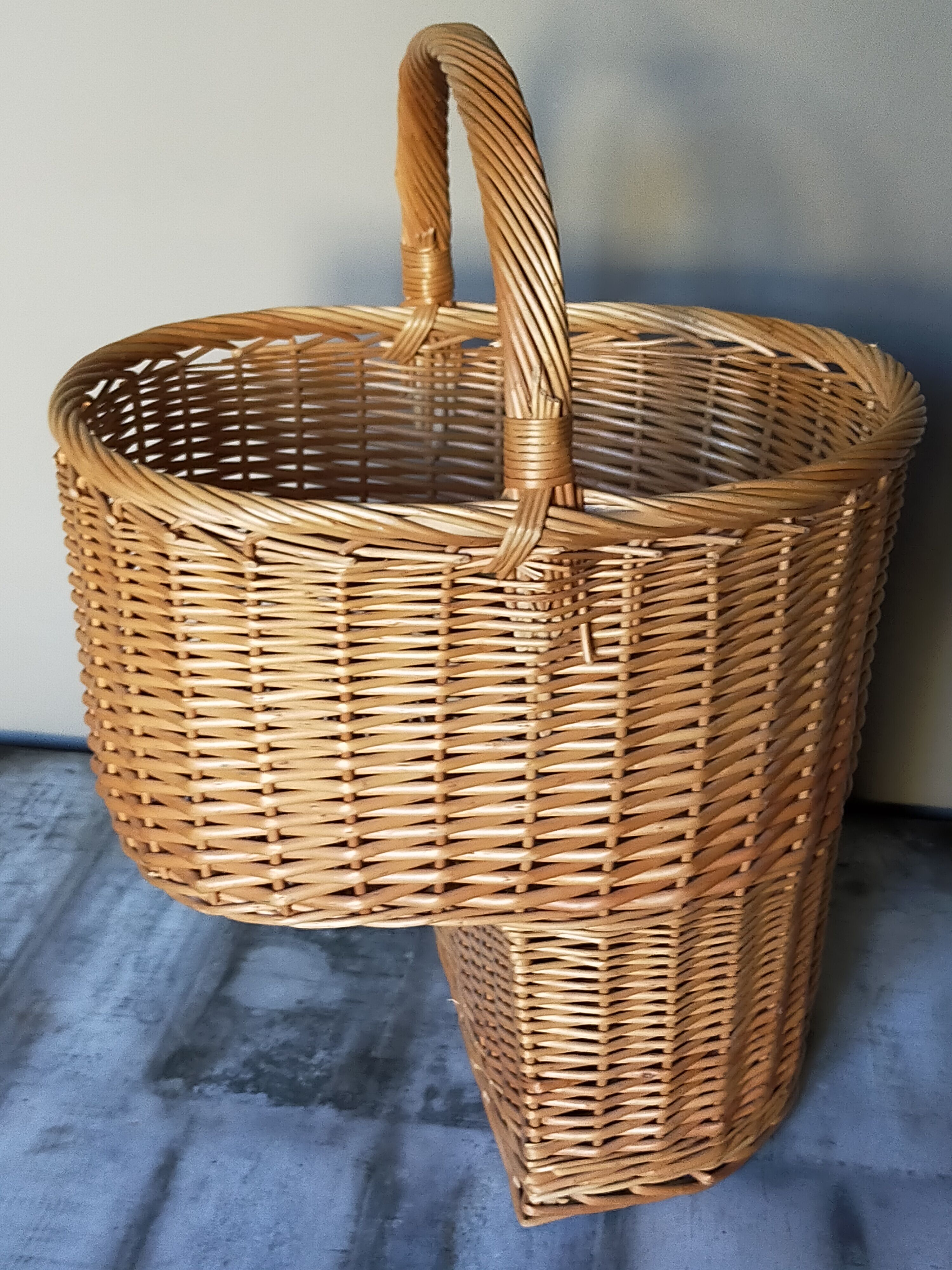 Asymmetrical woven rattan basket