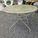 Old garden table in solid wrought iron