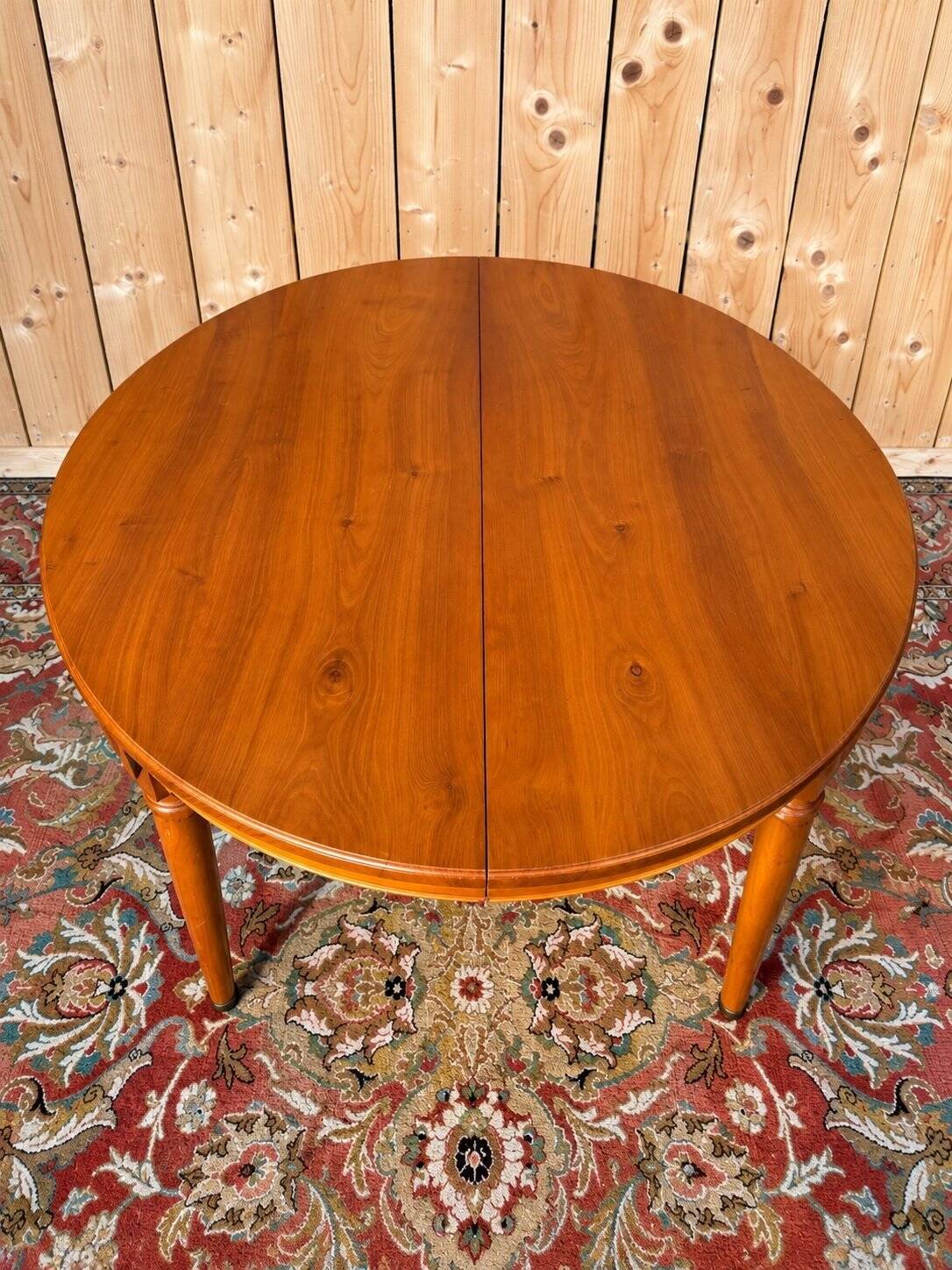 Louis XVI style dining table in cherry wood with extension.