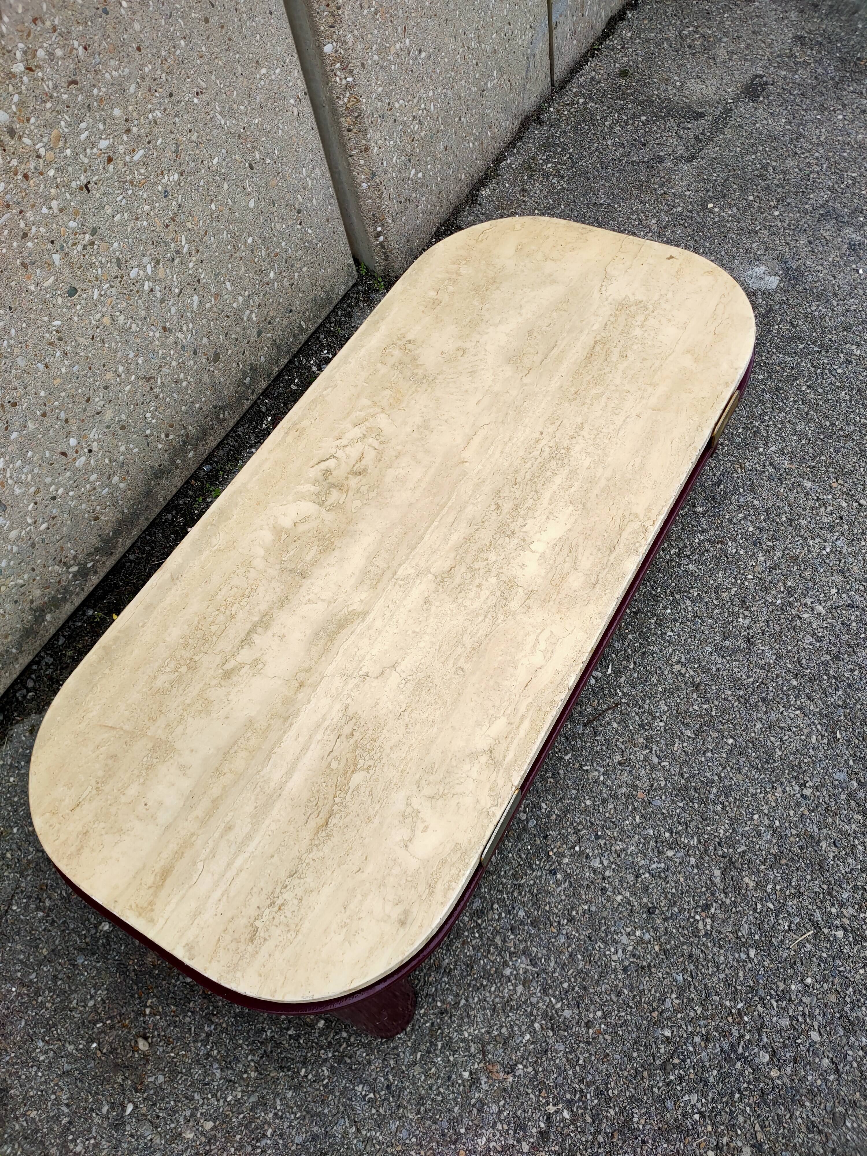 Coffee table Travertine top, garnet-colored metal stand and legs.  Long
