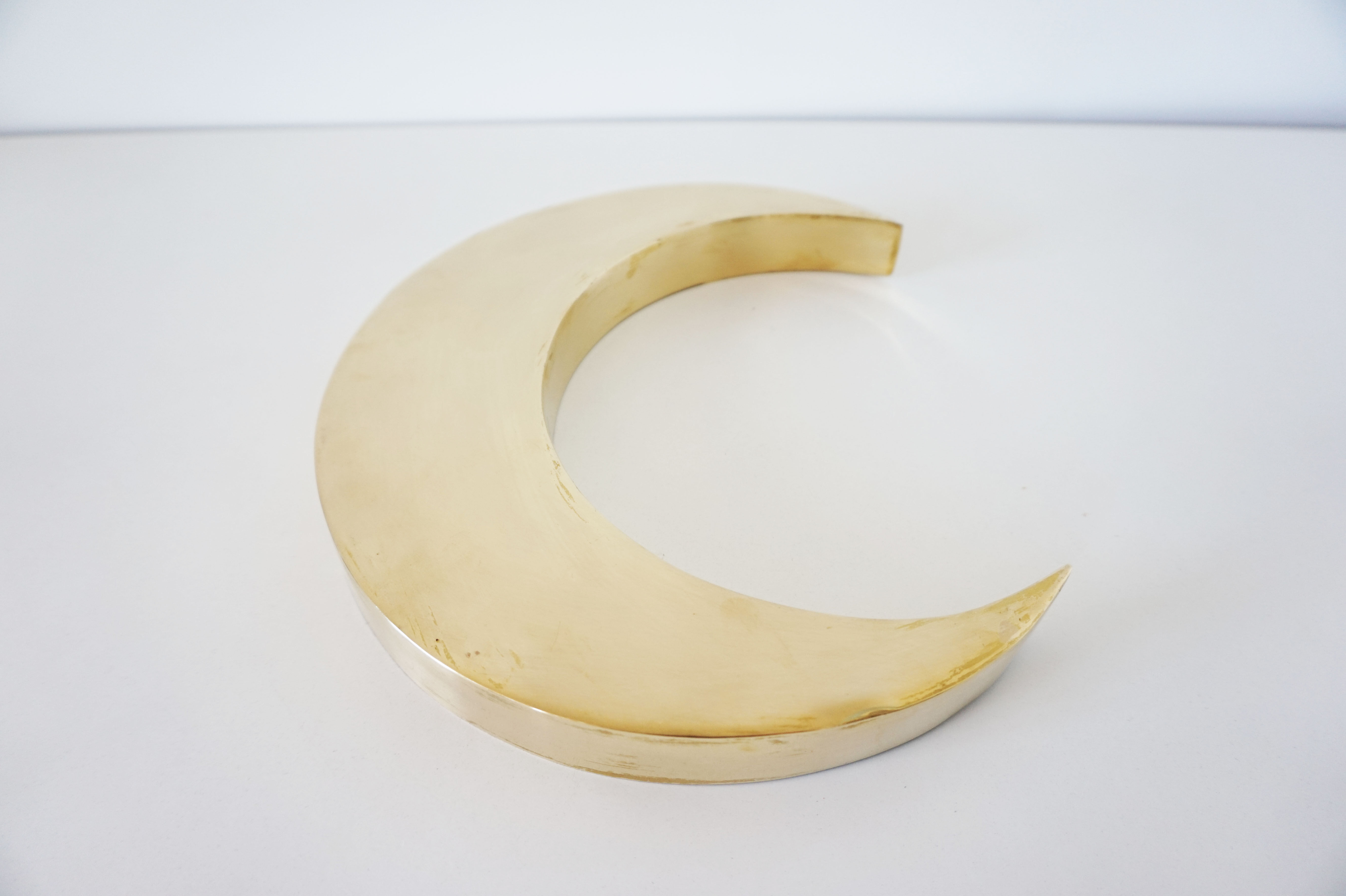 Moon or letter of sign "C" in vintage brass