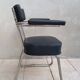 Vintage office chair in chrome metal and faux leather.