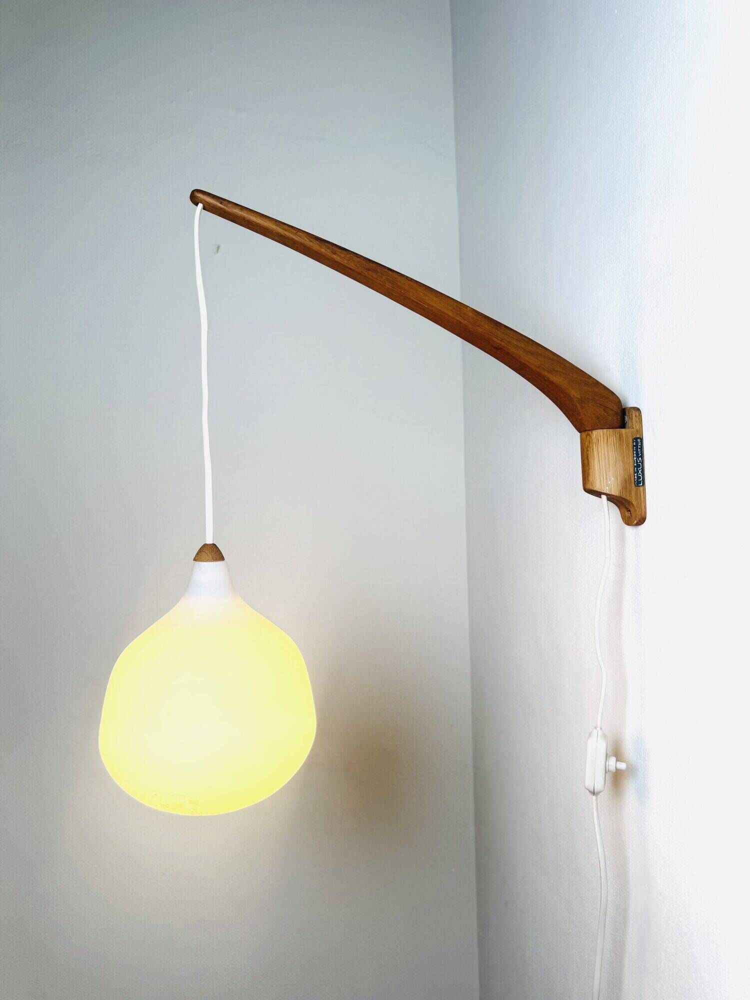 Model 705 Wall Lamp In Teak And Opaline Glass By Uno & Östen Kristiansson For Luxus, Sweden 1960S