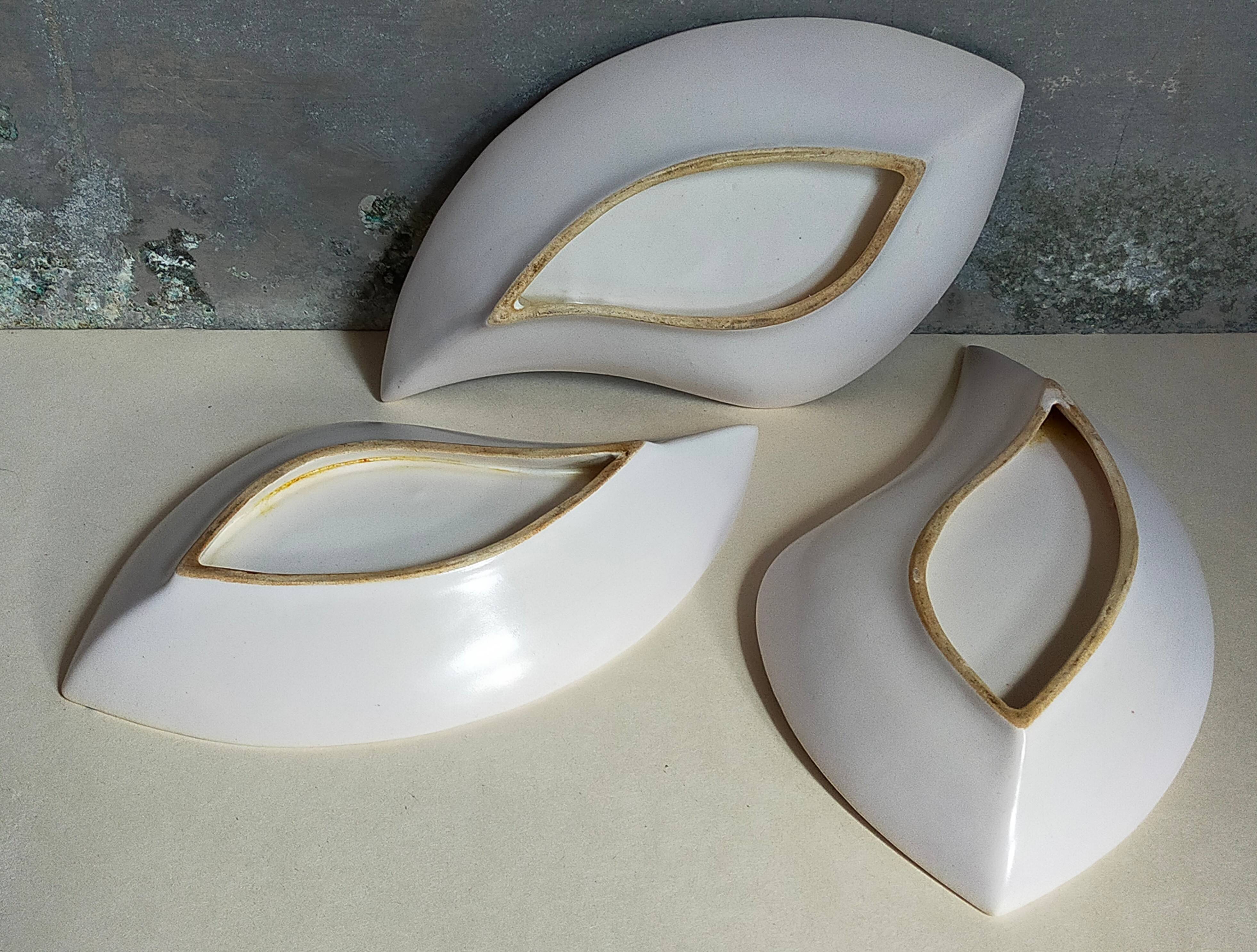 Three vintage free-form ceramic ravine dishes from the 1950s