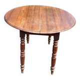 Louis Philippe round table with leaves, solid wood, 19th century, 95cm.