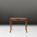 Side table with sculpted elements and rattan top