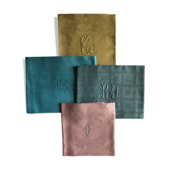 Suite of four tinted antique napkins