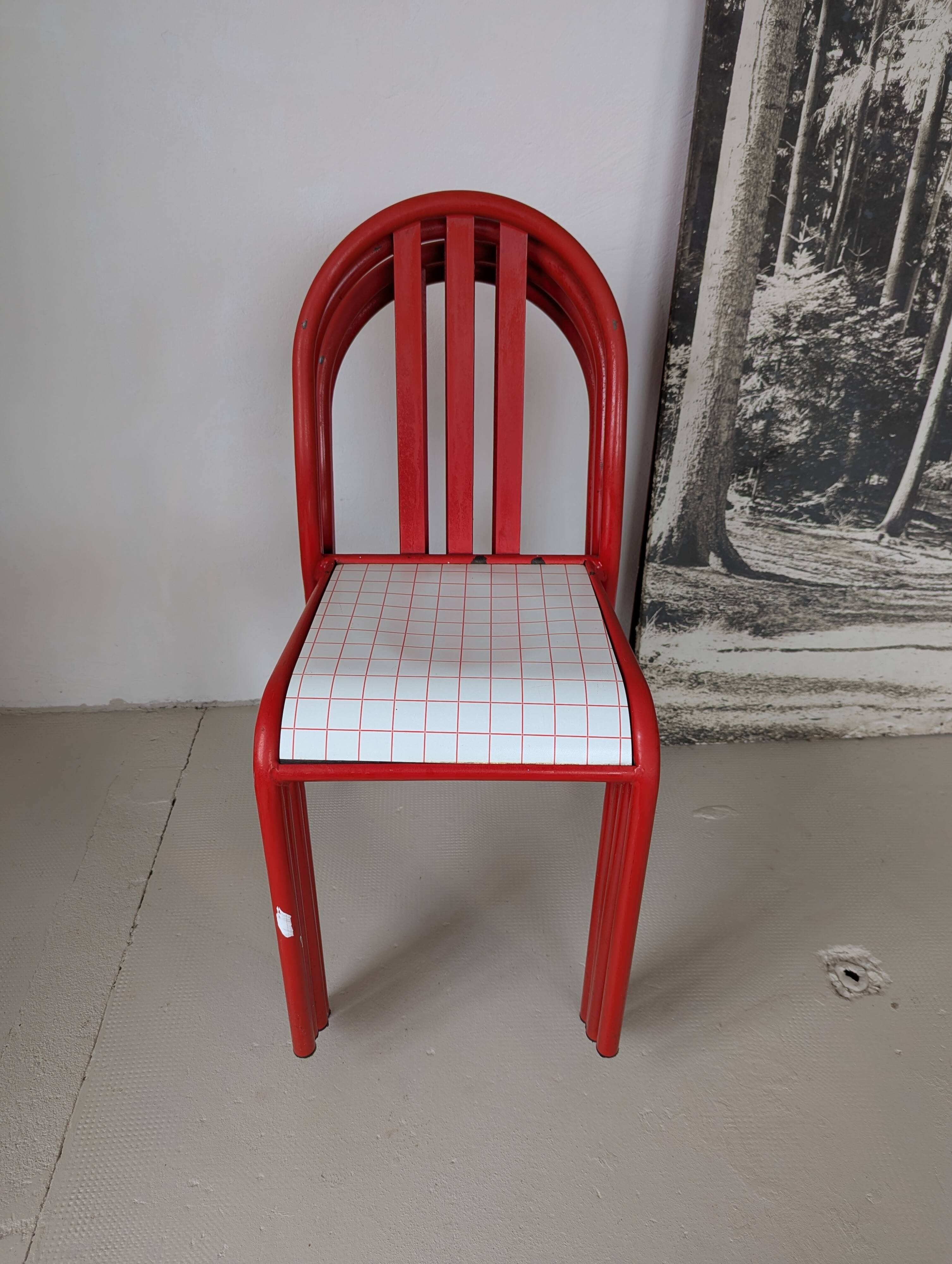 Set of 4 modernist red metal chairs