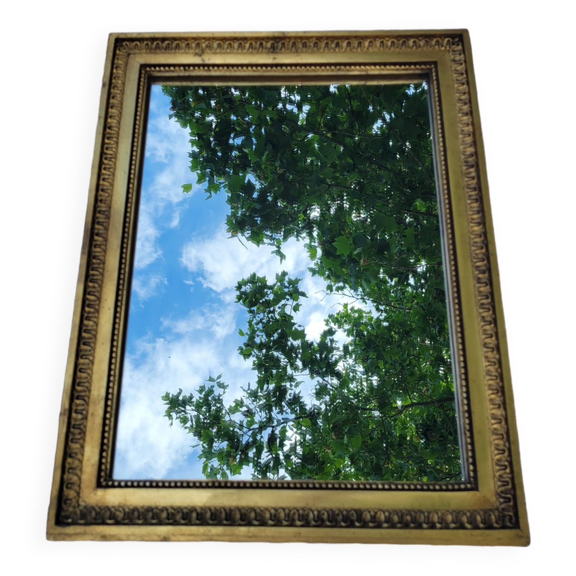 Old mirror in gilded wood