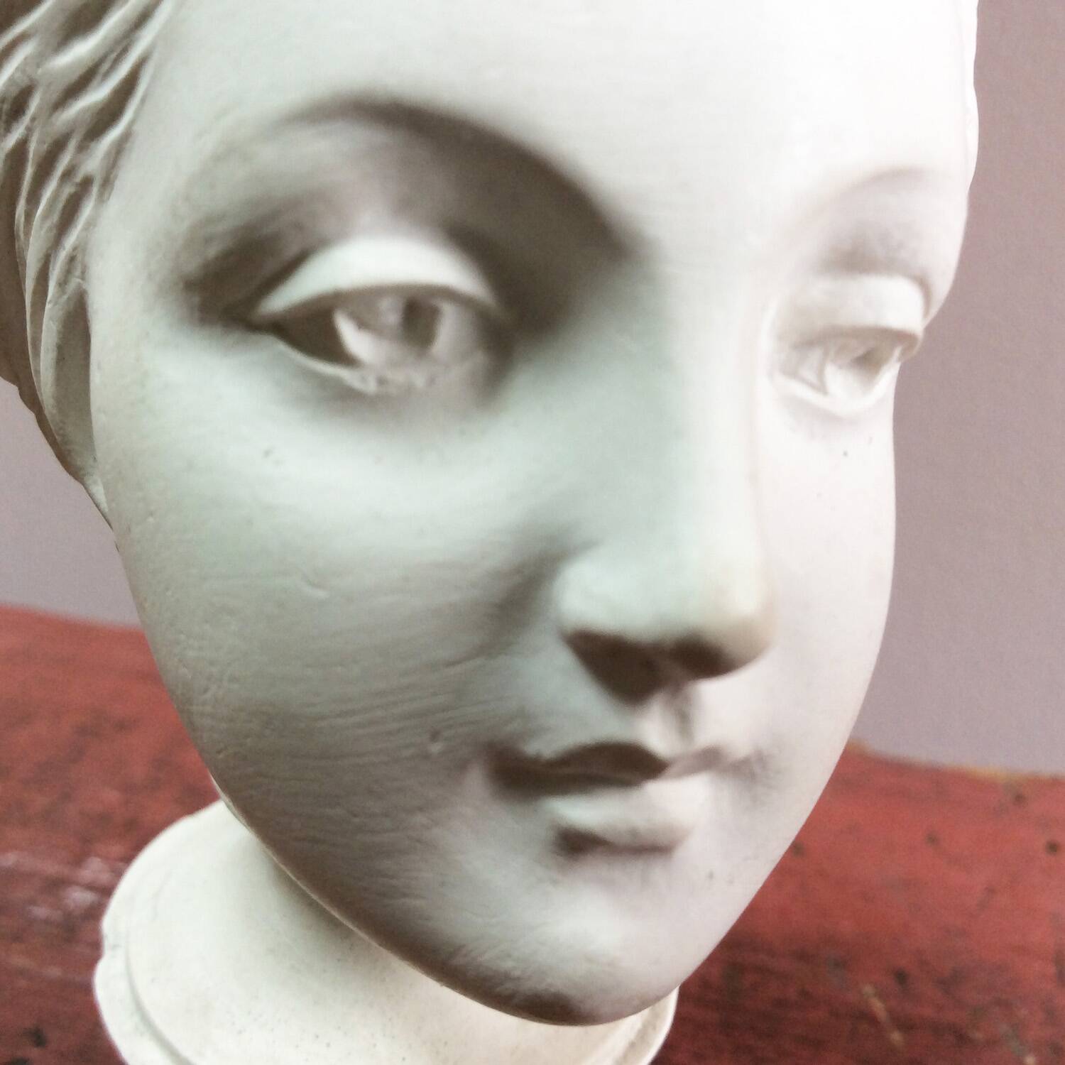 Plaster sculpture young woman with headband 1910