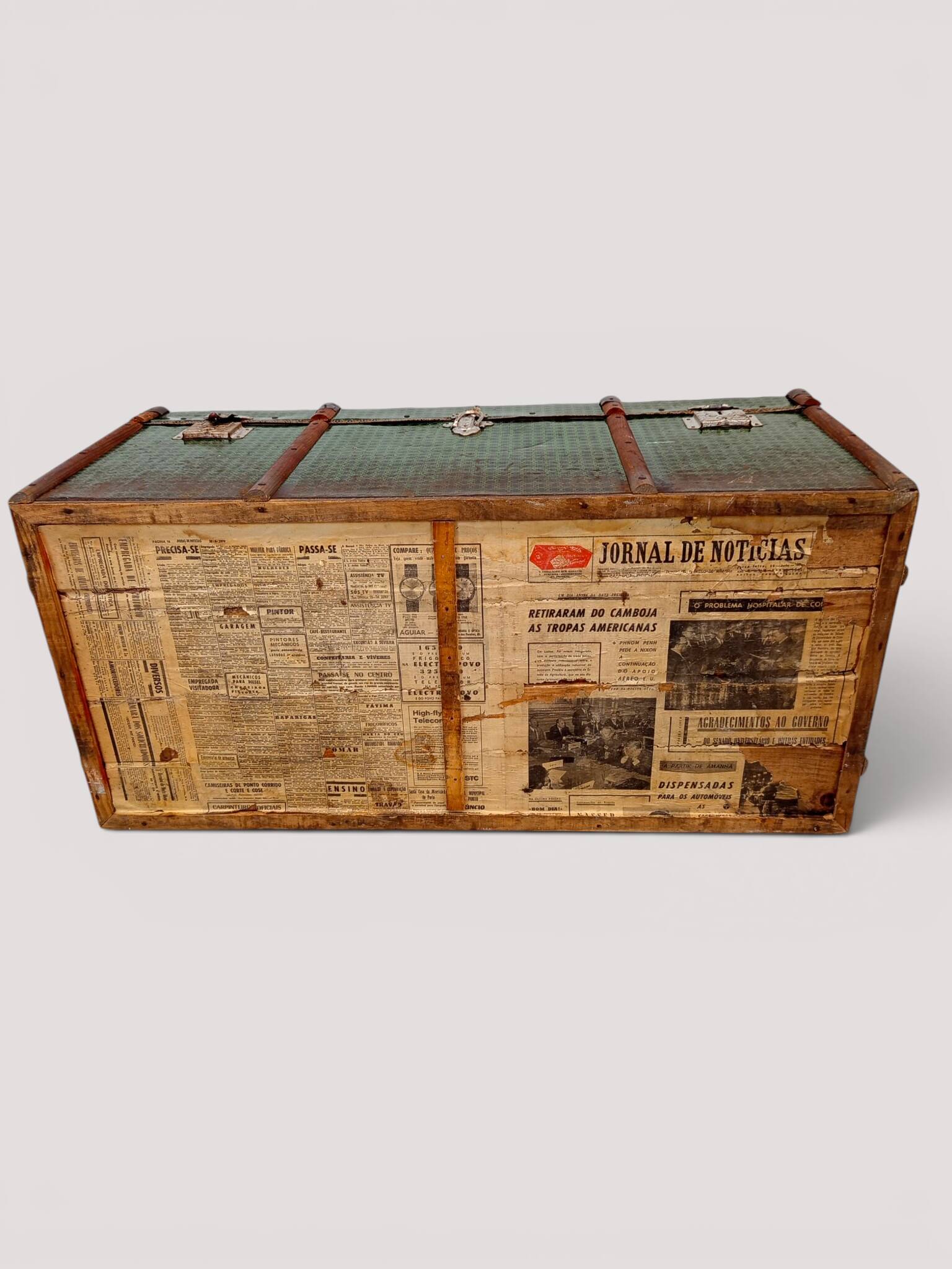 Vintage wooden and metal green travel trunk, circa 1930.