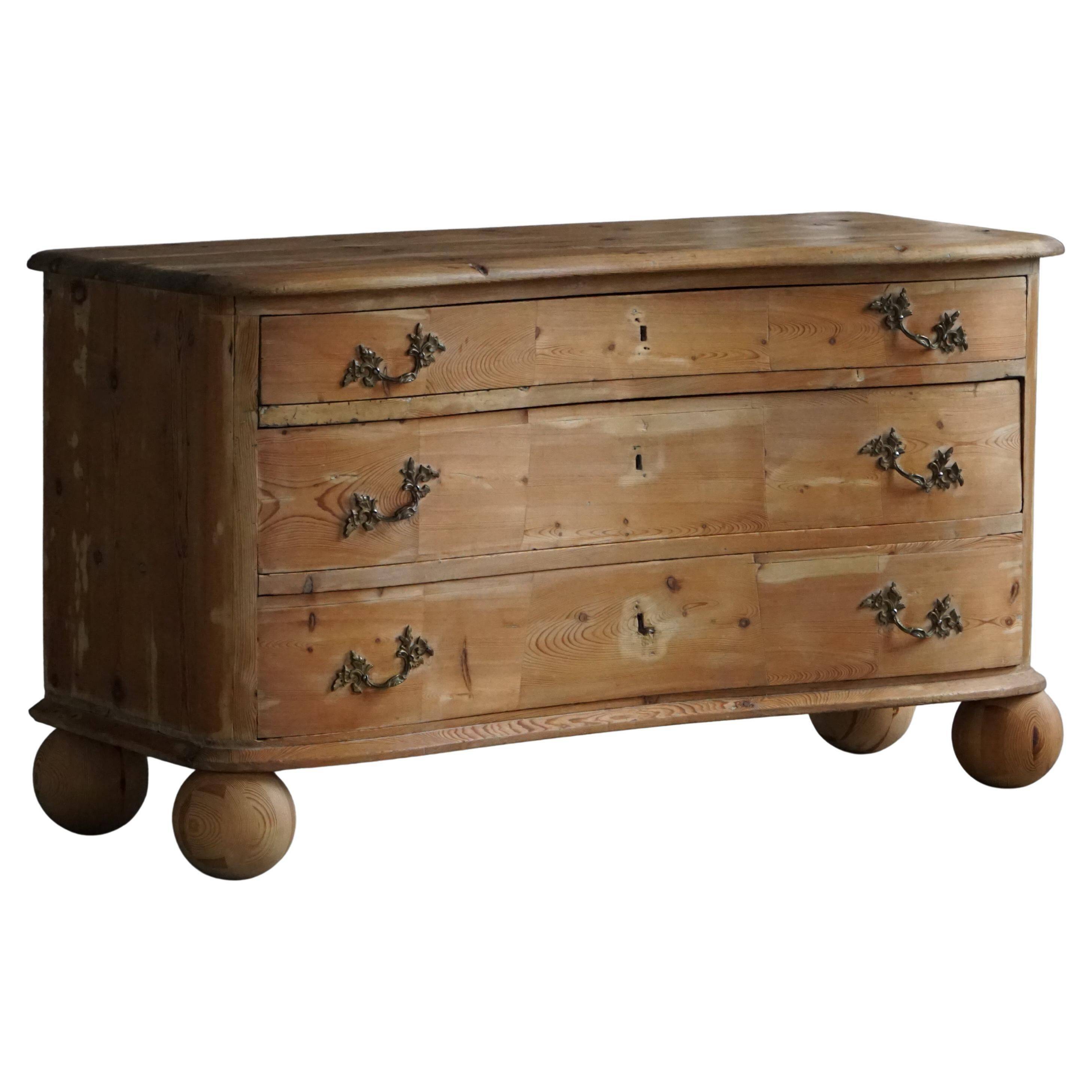 Antique Danish pine commode with ball feet, late 19th century.