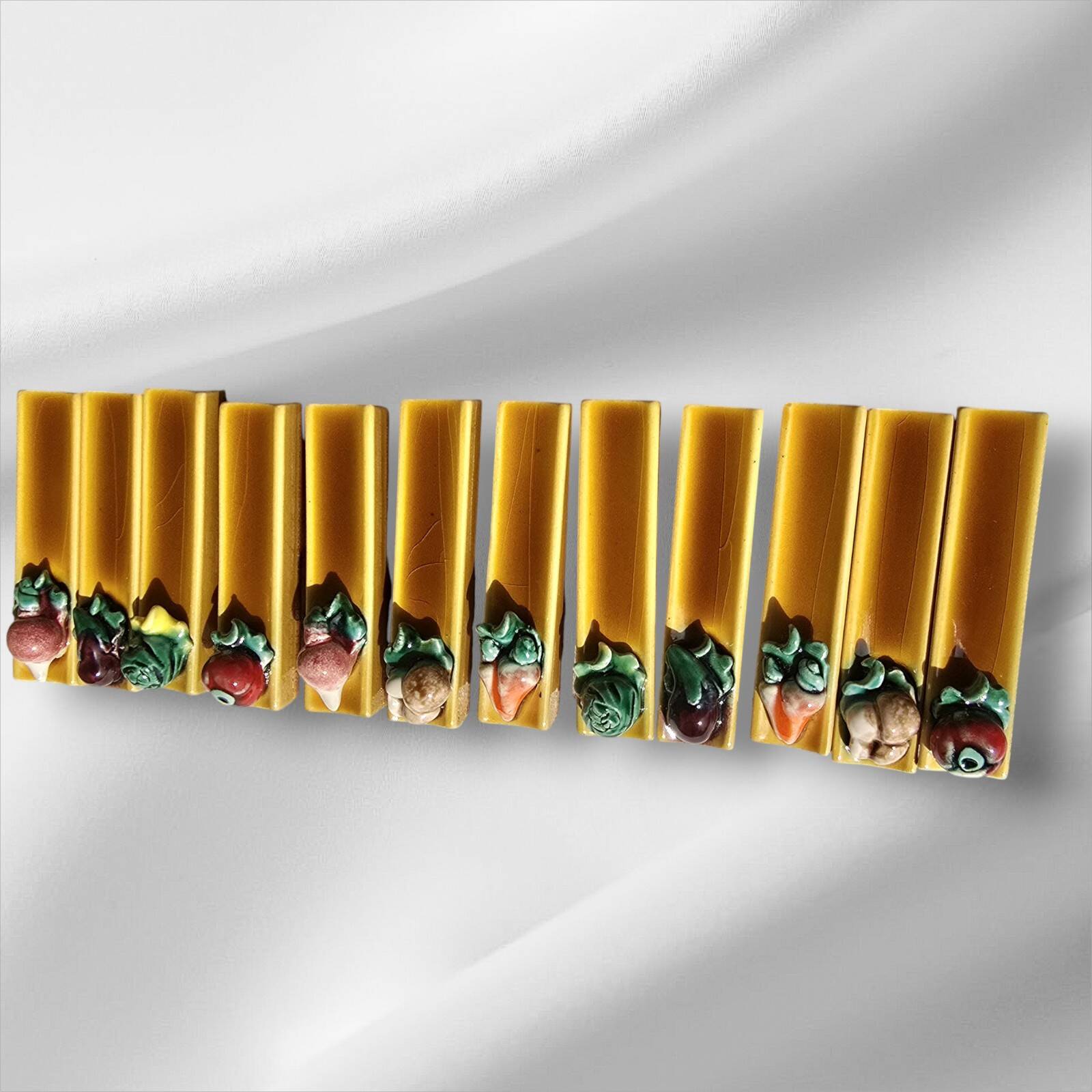 Set of twelve Vallauris majolica vegetable knife holders, 1950