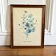 Vintage botanical board frame with blue flowers